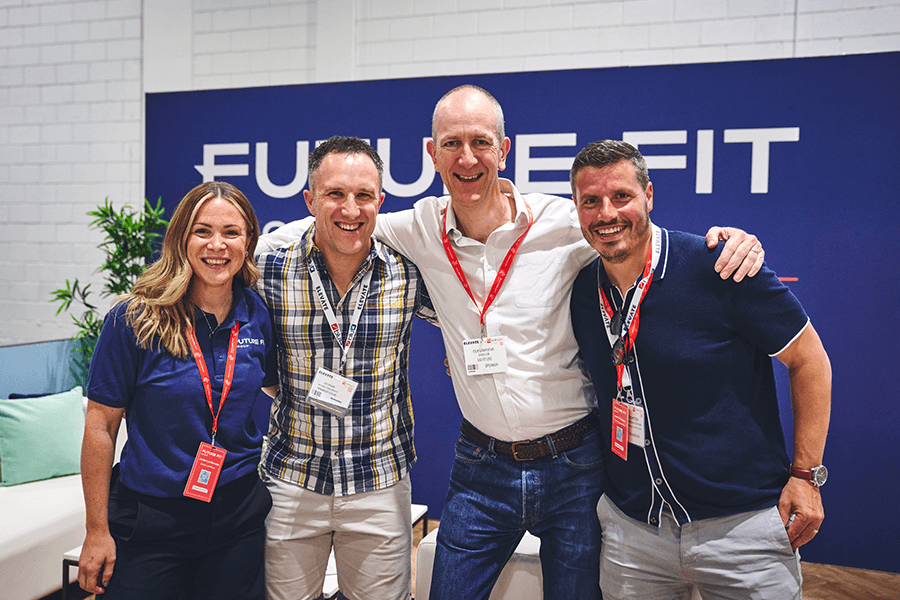 Guy Griffiths and Future Fit staff smiling together at Elevate London conference